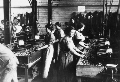 British women workers sorting ammo shells WW1