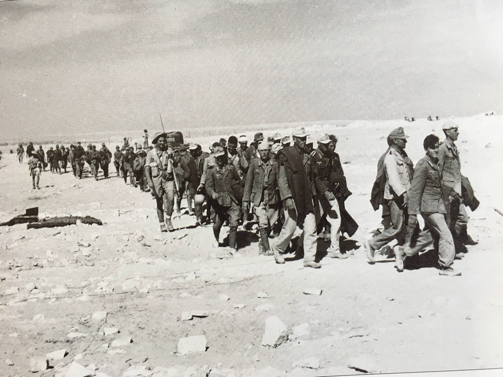British infantry bring in captured German and Italian prisoners in October 1942